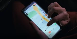 Person operating a GPS Tracking application on his mobile