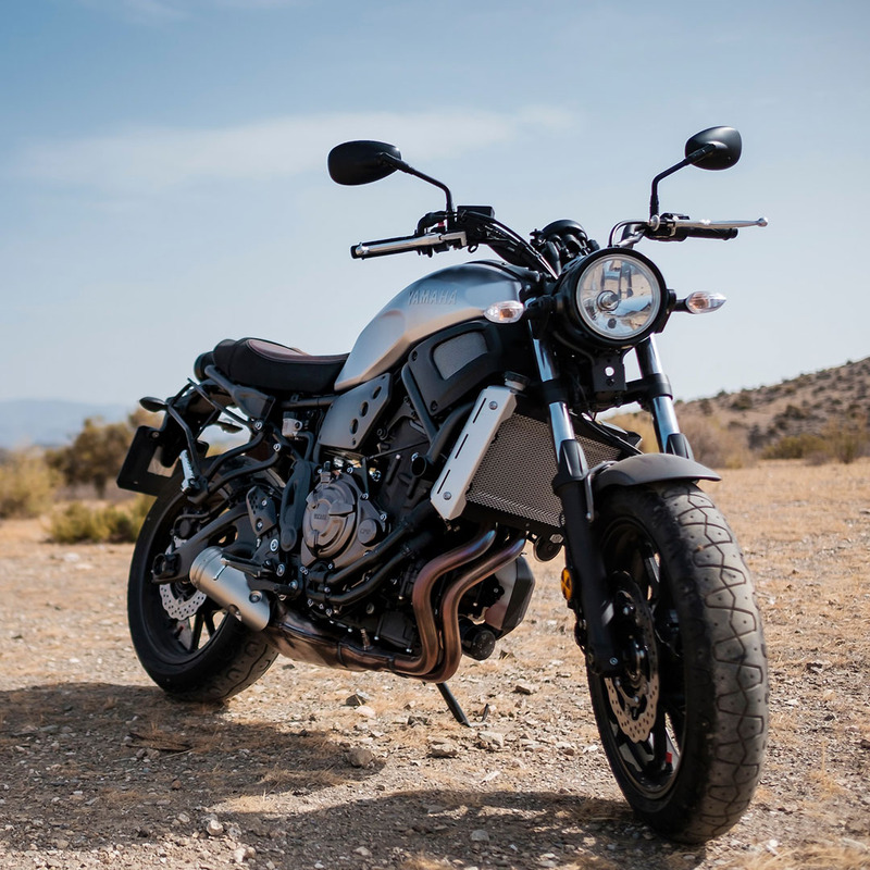 A motorcycle parked in a desert area with vehicle finder 4g 2.0 installed