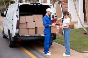 a fleet driver giving package to customer GPS Fleet Tracking Improves Customer Service
