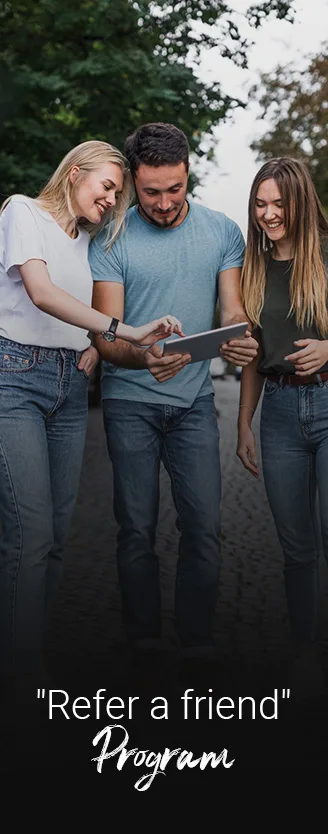three people looking on a tablet to refer a friend