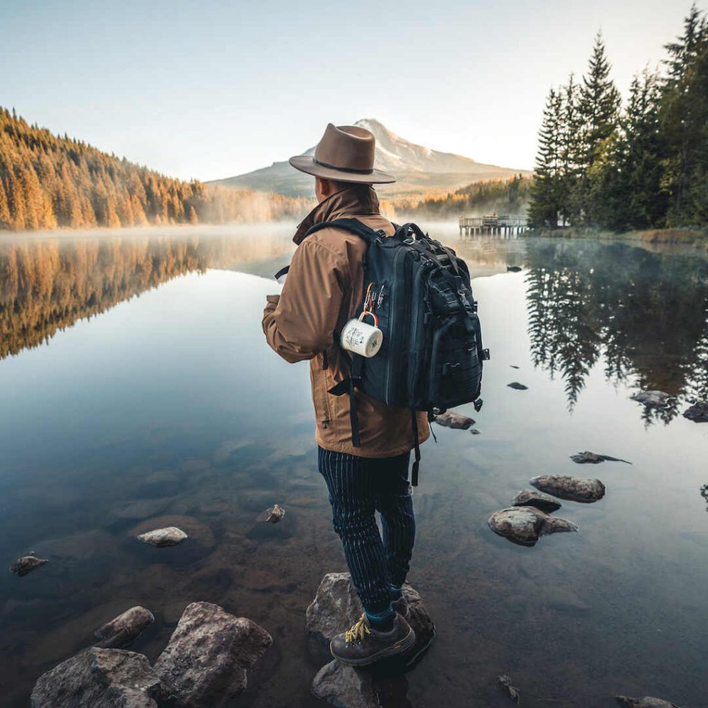 a hiker looking at mountains