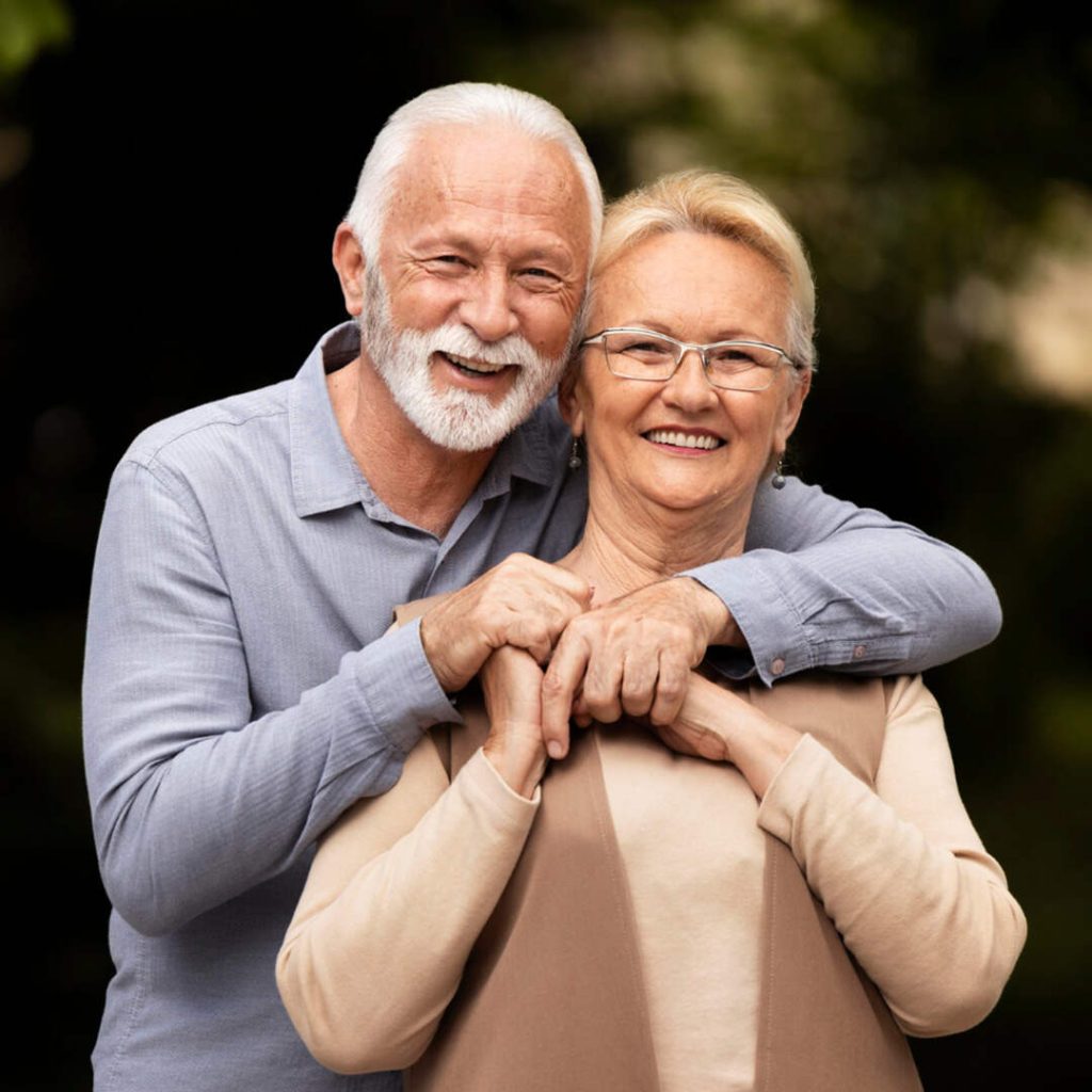 elederly couples posing together