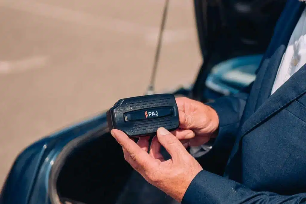 A man inspecting PAJ GPS power finder 4G