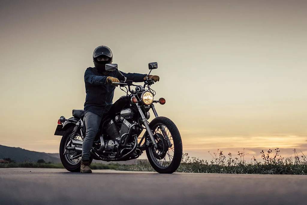 a rider on bike looking at camera