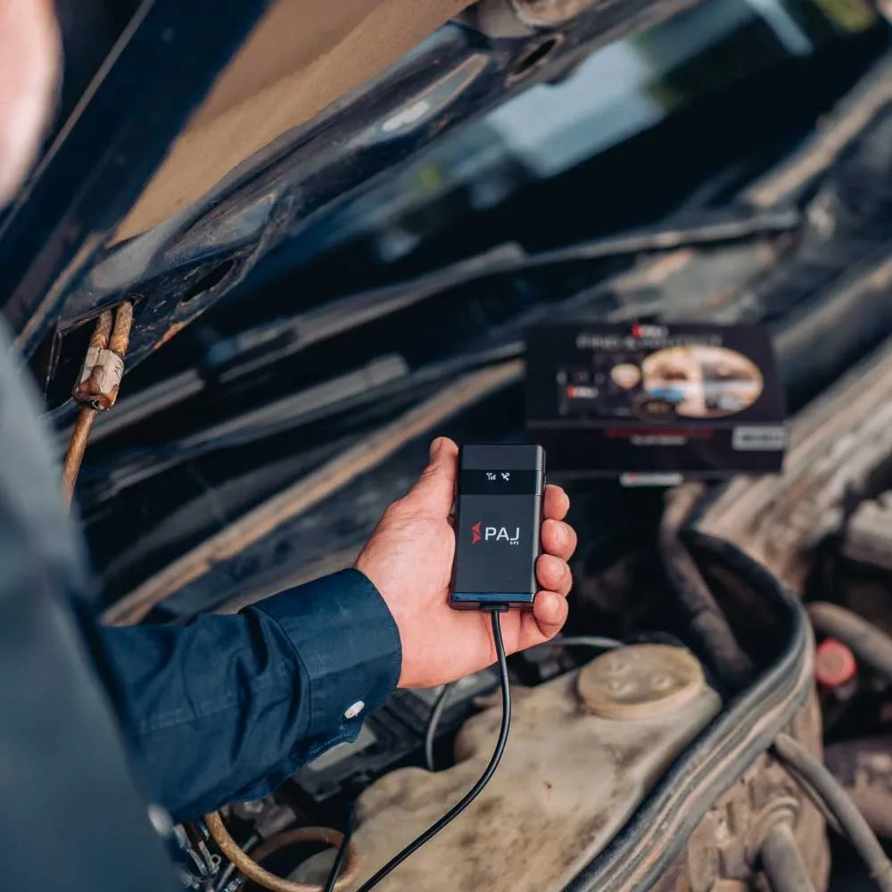 tracker car tracking A person installing vehicle finder 4g to the car battery of a Mercedes Benz car t