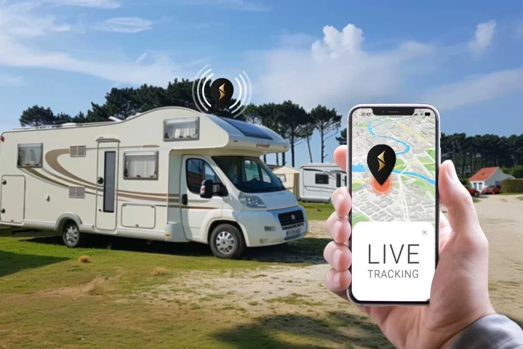 Motorhome in the background andphone in the foreground where the live location of the motorhome displayed