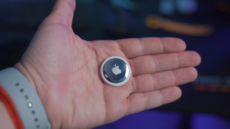 A apple airtag in hand found by reading how to find an airtag in my car.
