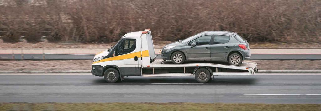 towing vehicle moving through road
