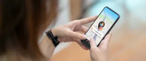 A girl looking at mobile and wondering about GPS tracking mistakes to avoid.