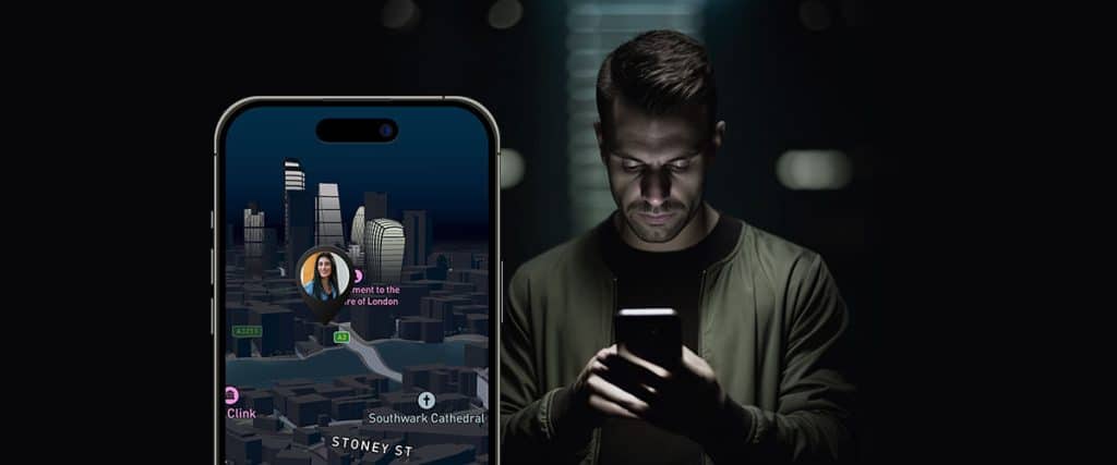 A man looking in phone for illegal way of tracking someone