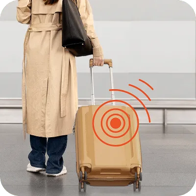 a women carrying a luggage which has luggage GPS tracker in it