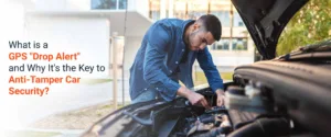 A person trying to take of GPS tracker from car, but GPS drop alert is active and provides car security.