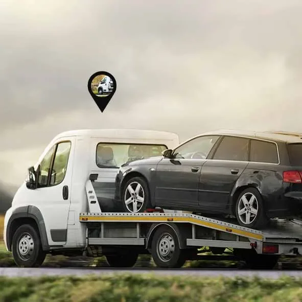 A towing vehicle moving through road with tow tracker set on it