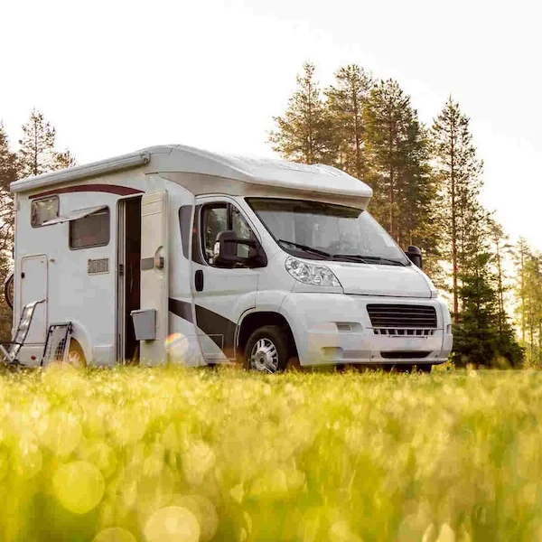 A white trailer parked in countryside protected with PAJ Vehicle GPS tracker